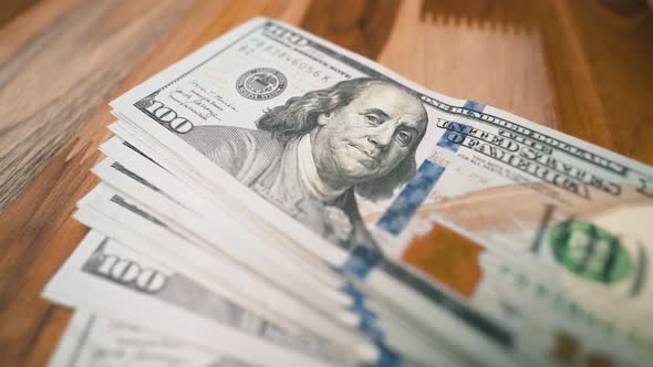 President Franklin one hundred dollar bills panning shot close-up