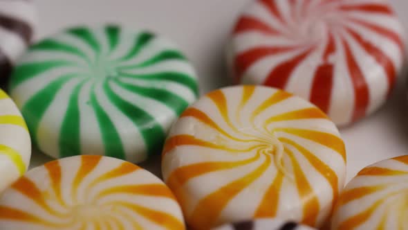 Rotating shot of a colorful mix of various hard candies 
