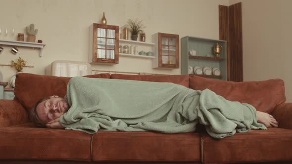 Handsome Man Sleeping on Sofa at Home