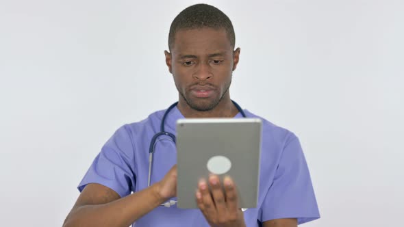 African Doctor Using Digital Tablet on White Background