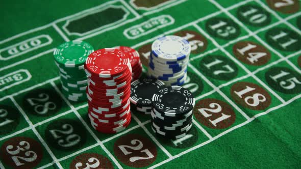 Casino chips on roulette on poker table