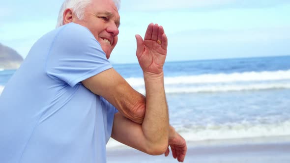 Senior man performing stretching exercise