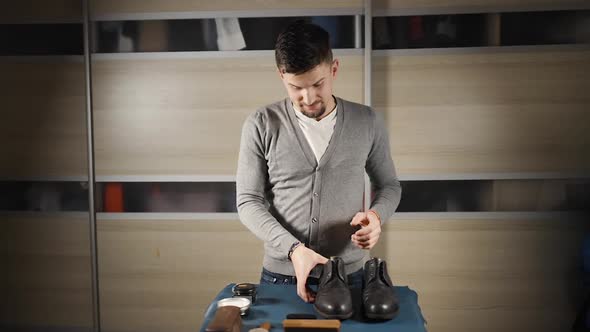 Male Blogger Filming Tutorial About Shoe Care