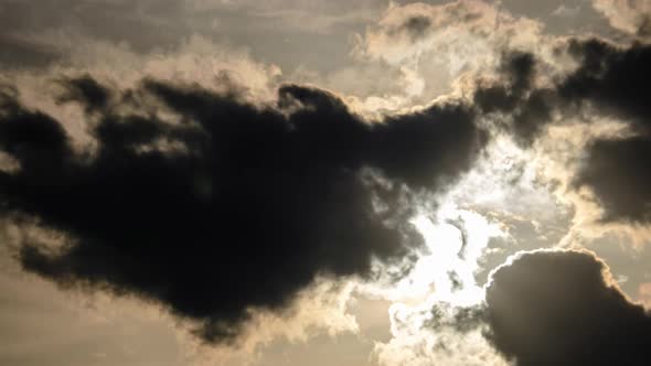 Dramatic Sunset with Sun Rays in Sky Through Orange Layered Clouds Timelapse