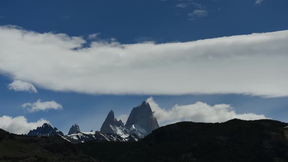 Time lapse of clouds moving over jagged mountain peaks in Patagonia