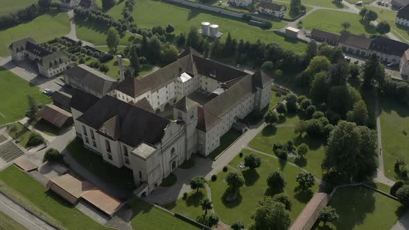 Abbey seen from above, surrounded by vegetation and trees. DJI Mavic alt