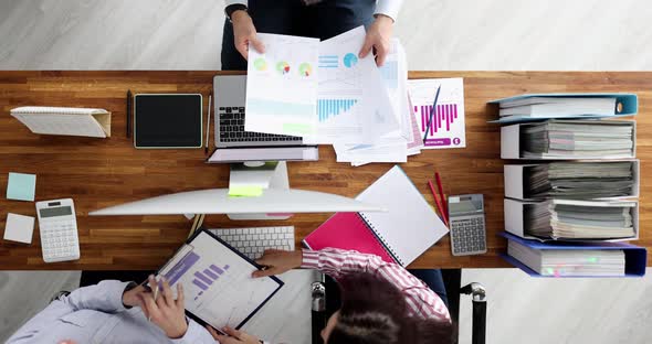 Group of Business People Working at Table with Documents and Computers Top View  Movie Slow Motion