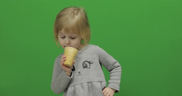 Kid Girl Eat Ice Cream on a Green Screen, Chroma Key