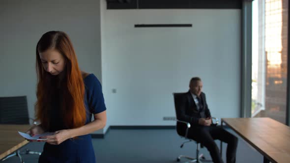 Lady Employee in Blue Formal Dress Leaving the Office After Being Fired, Employment and Crisis