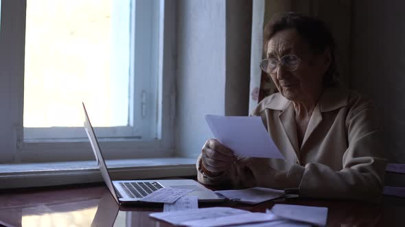 Senior Woman Make Video Call Using Laptop at Home