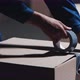 Packing Boxes with Construction Tape to Send the Order to Buyer From Warehouse - VideoHive Item for Sale