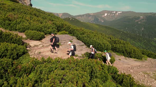 Aerial View on A Tourist Group Climbing Up a Stone Path