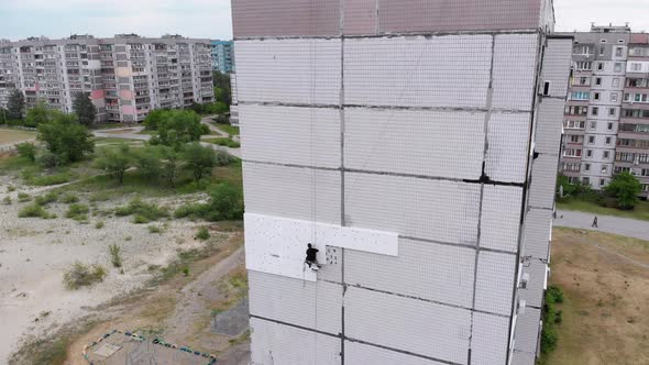 Industrial Alpinism. Aerial View. Work on Outer Insulate Building with Styrofoam