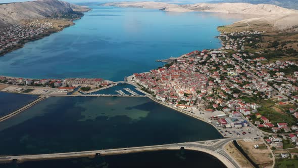 Pag Island Coastal Town With Scenic View Of Calm Sea At Daytime In Croatia. - aerial