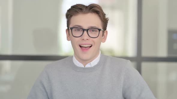 Portrait of Excited Young Man Celebrating Success