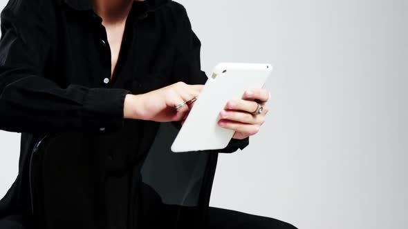 Androgynous man using digital tablet