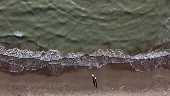 Aerial View to Durres Sandy Beach with Sun Beds and Umbrellas During Sunrise Early Morning