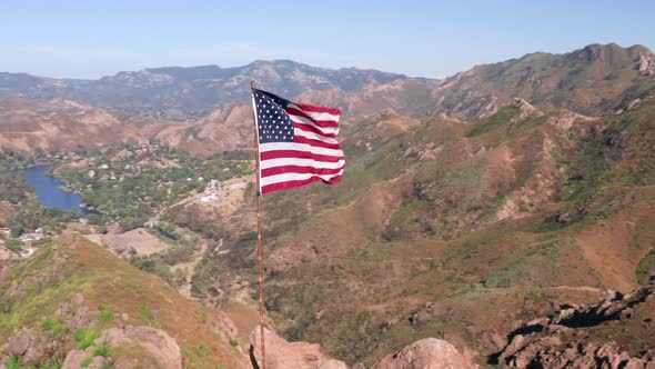 USA Flag on a Flagpole.  Aerial of the American Flag Is Fluttering on a Wind