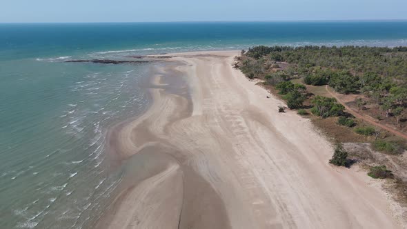 High Aerial drone shot of White Sandy Beach and Blue Water Darwin, Northern Territory