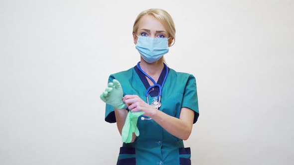 Medical Doctor Nurse Woman with Stethoscope Wearing Protective Mask and Rubber or Latex Gloves