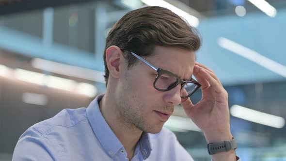 Close Up of Young Man Having Headache