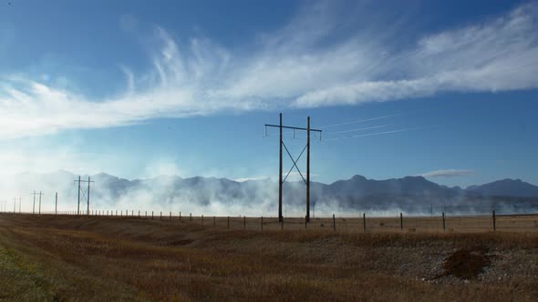 Smoke from fire by the powerlines wide