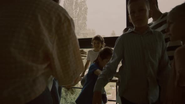 Angry Schoolchildren Pushing Aggression Victim Mocking Together in Hallway