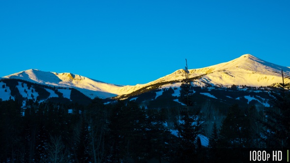Time Lapse of Snow Covered Rocky Mountain Range at Sunrise