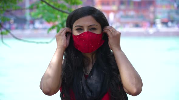 Indian Woman Wearing Coronavirus Protection Face Mask Holy River Ganges Flowing in Background