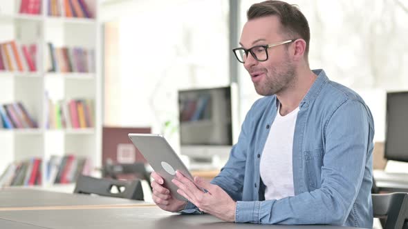 Video Chat on Tablet By Young Man