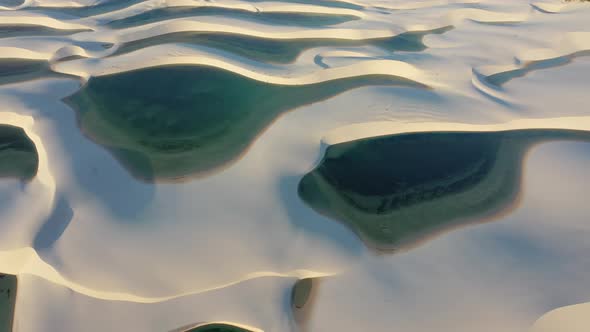 Sand dunes mountains and rain water lagoons at northeast brazilian paradise.