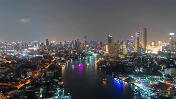 Time lapse of boats with Chao Phraya River, Bangkok Downtown skyline. Thailand.