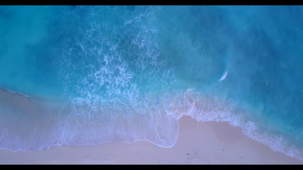 Aerial panorama of marine shore beach trip by blue ocean and white sandy background of a dayout near