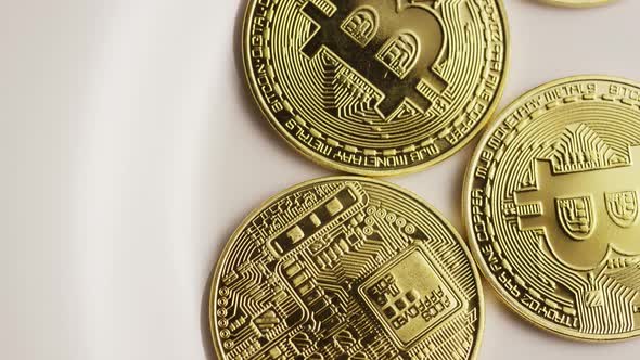 Rotating shot of Bitcoins (digital cryptocurrency) - BITCOIN 