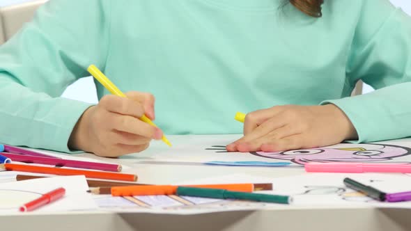 Child Begins To Draw His Drawing with Different Pencils. Close Up. Time Lapse