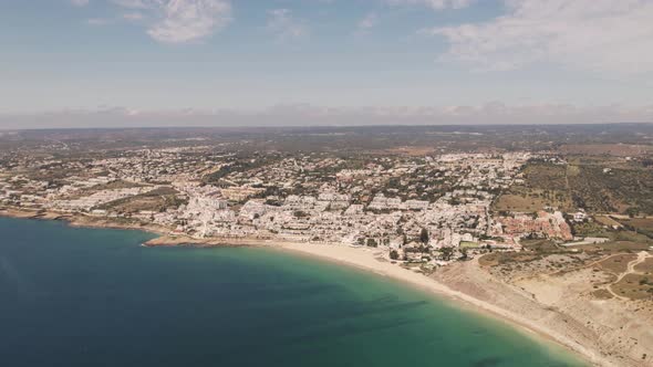 High Aerial over Praia da Luz and Algarve Skyline, Portugal. Aerial