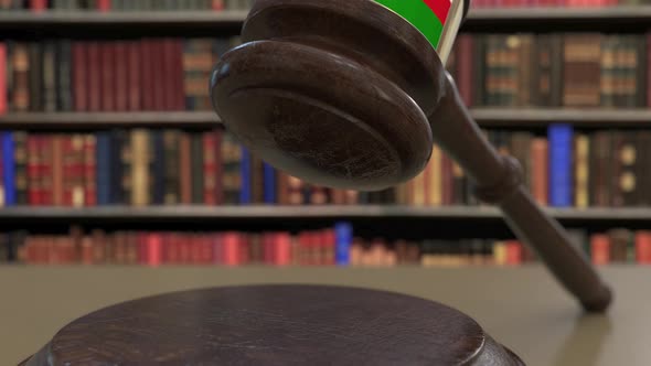 Flag of Oman on Falling Judges Gavel in Court