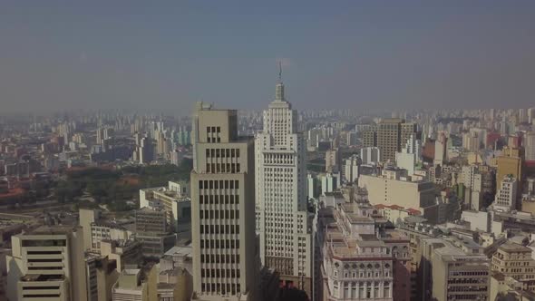Drone Tall Downtown Banespa Office Buildings On Sunny Day With Sao Paulo Flag 4k