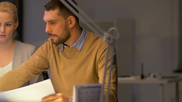 Business Team with Laptop Working at Night Office