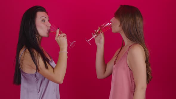 Lesbian Couple of Two Pretty Young Girls Drinking Champagne Celebrating New Year