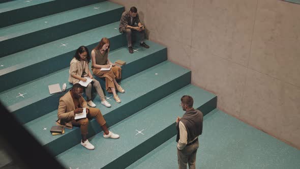 Top View of University Students Having Lesson on Stairs