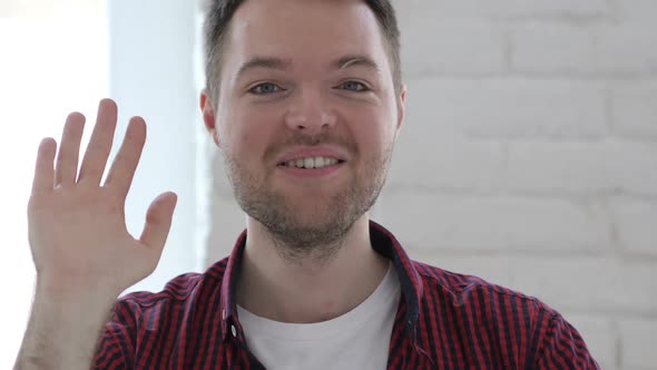 Hello Young Man Waving Hand to Welcome