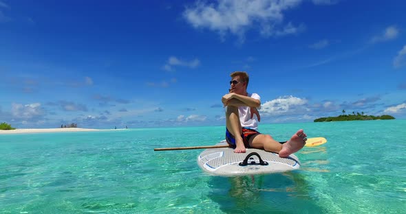 Fun boy and girl on romantic honeymoon enjoy luxury on beach on paradise white sand background 