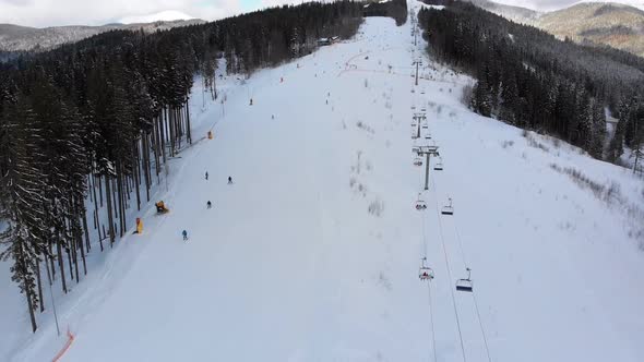 Aerial View on Ski Slopes with Skiers and Ski Lifts on Ski Resort in Winter