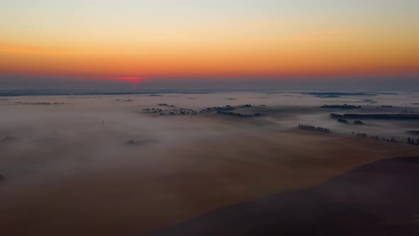 Aerial Timelapse Hyperlapse Summer Morning Flight Over Forest and Misty Fields