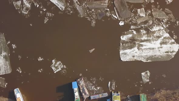 Some Boats on the River Bank While the Ice Drift in Spring Time