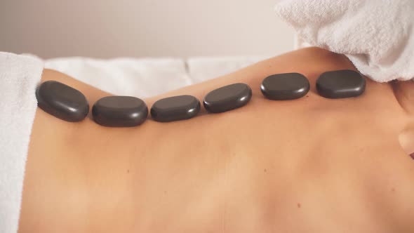 Stone Massage Procedure. Holidays at Spa Center.
