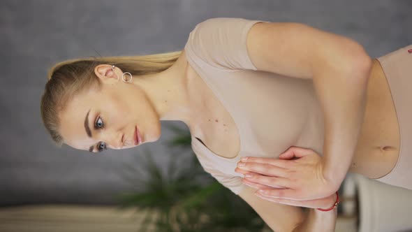 Attractive Female Coach Yoga Makes Namaste Gesture By Hands