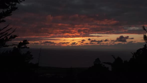 Ominous view of as the sunsets with a cloud covered landscape.