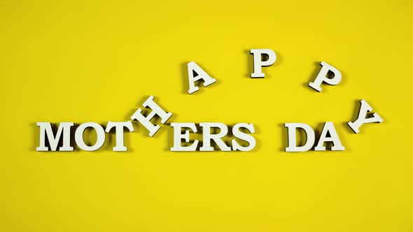 Yellow Background with Happy Mothers Day Title. White Letters, Stop Motion Animation